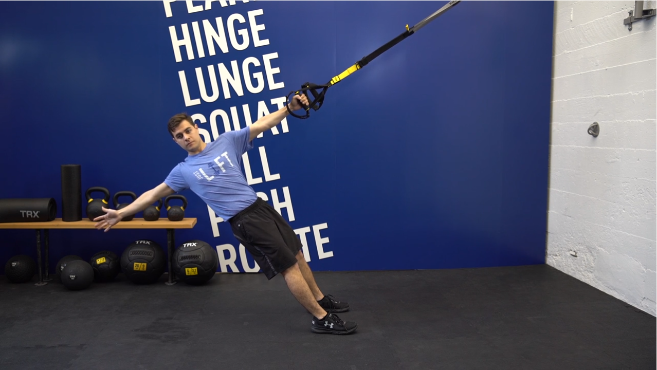 Image description: A young man demonstrating a TRX Power Pull