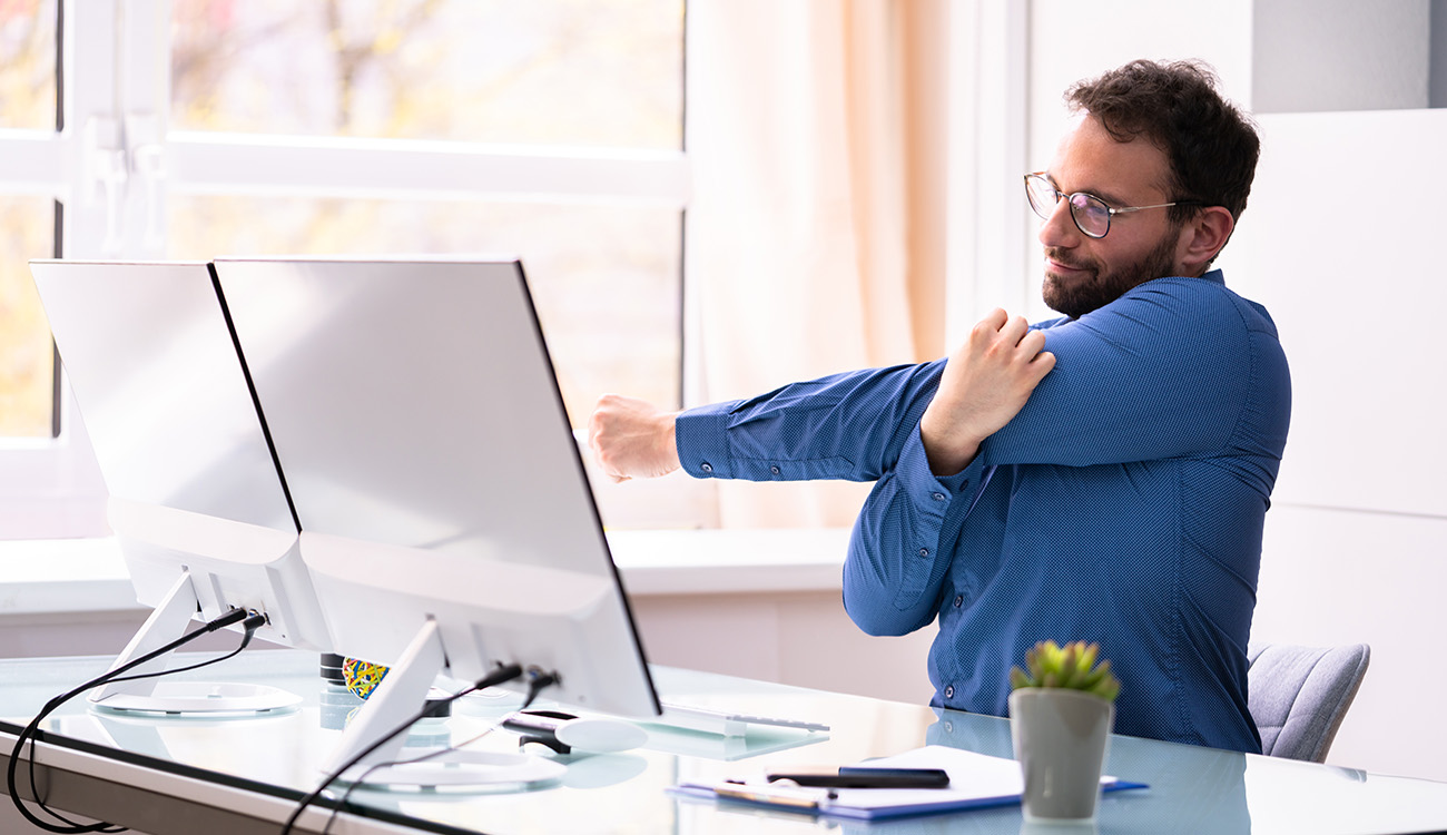 Here Are 5 Stretches You Can Do At Your Desk